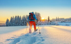 Person snowshoeing in powder snow